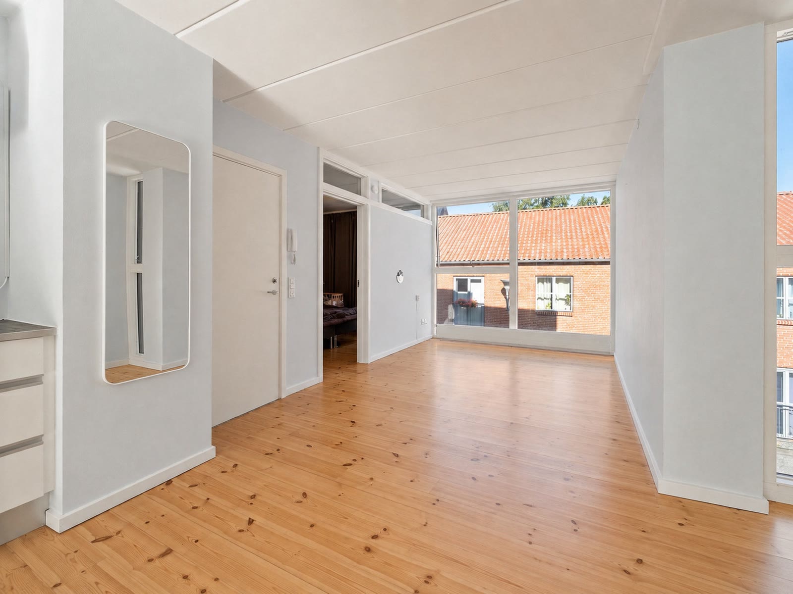 An empty room, as photographed for the listing
